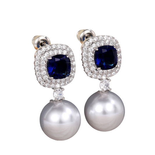 a pair of blue and white pearls and diamond earrings